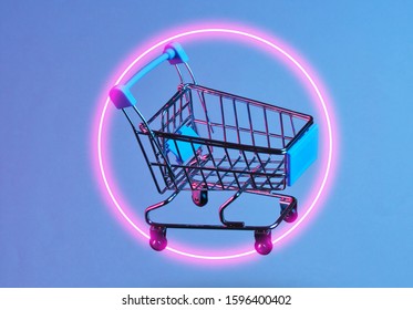 Minimalism Shopping Concept. Toy Shopping Trolley, Circle Neon Night. Retro Wave