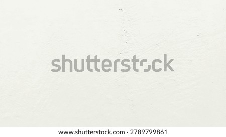 A minimalist abstract background with a soft, light texture and subtle variations in tone.