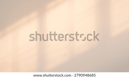 A minimalist abstract composition featuring the interplay of light and shadow on a beige surface, creating a subtle and elegant design.