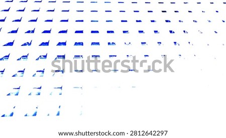 Minimalist architectural facade with repeating square perforations and blue sky