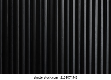 Minimalist art picture: black pencils next to each other form vertical dark lines. Artistic, elegant design structure for graphics, backgrounds.