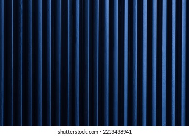 Minimalist art picture: black pencils next to each other with blue color light form vertical dark lines. Artistic, elegant design structure photo for graphics, backgrounds. - Powered by Shutterstock