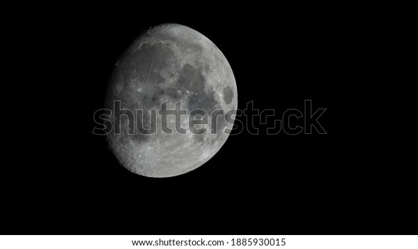 A\
minimalist black and white image of the moon\
surface.