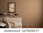 Minimalist composition of aesthetic living room interior with mock up poster frame, copy space, modular sofa, brown sideboard, vase with dried flowers and personal accessories. Home decor. Template.