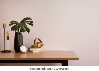 Minimalist composition of elegant home office space with design chair, black vase with leaf, sculpture, book and personal accessories. Copy space. Minimalist home decor. Template.	
 - Shutterstock ID 2199808489