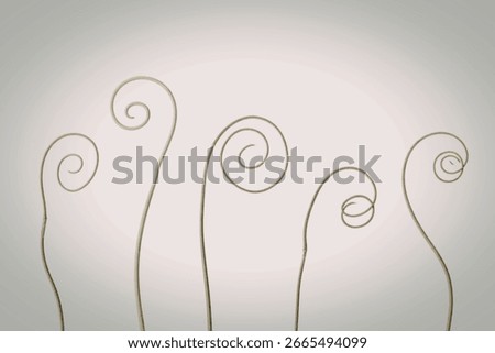 A minimalist composition featuring five slender, light green plant tendrils