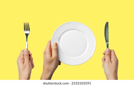 Minimalist Dining Setup Fork, Knife, and Empty Plate on Vibrant Yellow Background