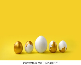 Minimalist Easter composition. Golden paint pouring eggs in row on yellow background. Greeting trendy color concept with copyspace. - Powered by Shutterstock