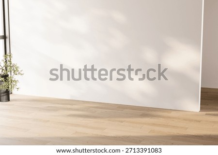 Minimalist empty room featuring a large white wall and light wood floor with natural shadows. Clean copy space for advertising and mock-ups. 3d Rendering