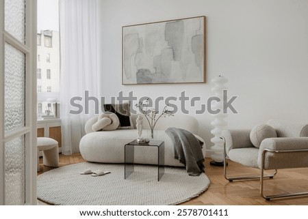 Minimalist interior featuring soft lighting, a boucle chair, and sculptural decor. A blend of modern elegance and tranquility.
