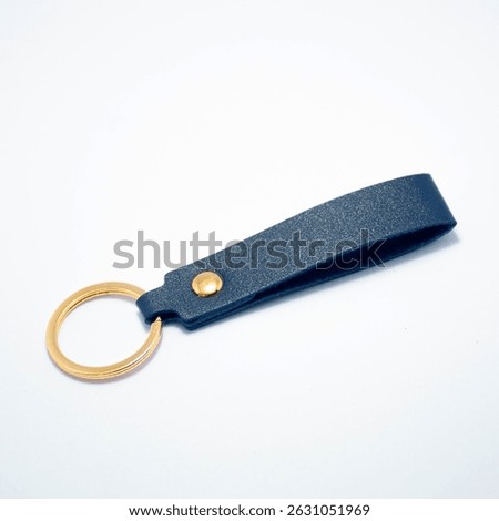 Minimalist leather keychains in a variety of solid colors on clean backgrounds. Ideal for product catalogs, retail branding, online shops, or promotional use in accessory collections.

