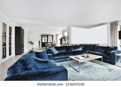 Minimalist Living Room With Blue Velvet Sofa