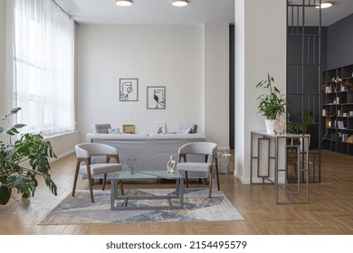 minimalist modern interior design huge bright apartment with an open plan in Scandinavian style in white, blue and dark blue colors with columns in the center. includes kitchen area, office and lounge - Shutterstock ID 2154495579