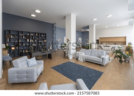 minimalist modern interior design huge bright apartment with an open plan in Scandinavian style in white, blue and dark blue colors with columns in the center. includes kitchen area, office and lounge