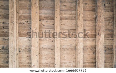 Minimalist old ceiling with boards and beams. Wooden construction. Loft interior finish.