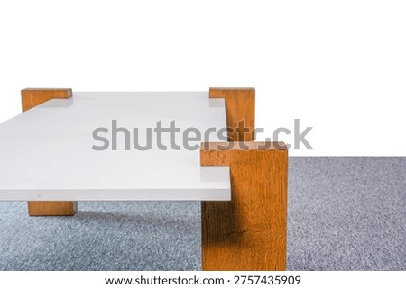 A minimalist rectangular side table featuring a polished white stone surface and solid natural oak legs in a bright interior setting. Handmade clipping path included.