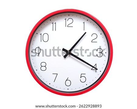 Minimalist red framed wall clock pointing at 01:20 or 13:20. Isolated on white background. Concept of time management.