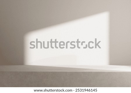 Minimalist scene with soft light casting geometric shadows on a neutral wall. Subtle shadows and soft light create a calming, minimalist atmosphere. Product backdrop and showcase. Minimal backdrop.
