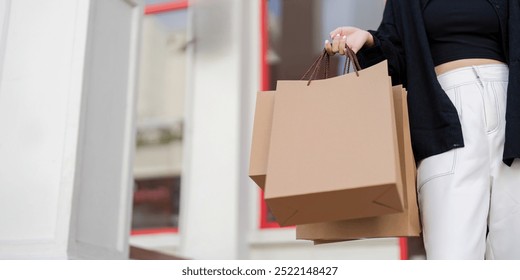 Minimalist Shopper with Eco Friendly Bags During Black Friday Shopping - Powered by Shutterstock