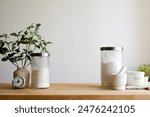 Minimalist still life kitchen counter top with baking ingredient and utensil on a wooden surface. Aesthetic appeal related to interior design and cooking background with copy space. 