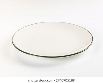 Minimalist studio shot of a single, empty white plate with a dark green rim. High-key lighting on a clean white background. Classic, simple design for food, dining, or conceptual use.