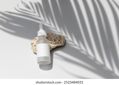 Minimalist Summer Skincare Mockup: Frosted Glass Bottle on Stone Podium with Palm Leaf Shadow Overlay