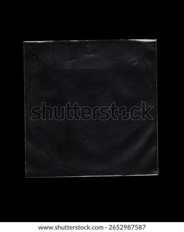 Minimalist view of a clear square CD, DVD plastic sleeve without a flap. The black background highlights the shape and material details. Great for mockup design, data storage concepts