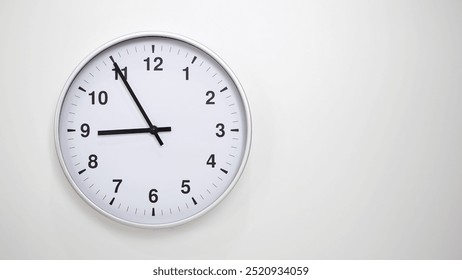 Minimalist White Clock with Silver Frame Striking 21.55 or 09.55 on White Background – Perfect for Time Management and Corporate Campaigns - Powered by Shutterstock