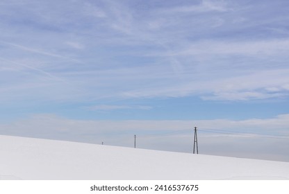 minimalist winter scene with old power line - Powered by Shutterstock