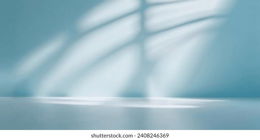 Minimalistic abstract gentle light blue background for product presentation with light and intricate shadow from window on wall.