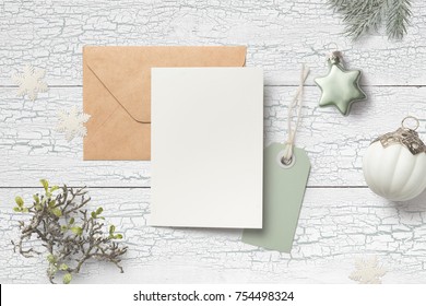 Minimalistic Christmas Card Mock Up With Green Fir Branches, Baubles, Card, Envelope, Hangtag And Glitter Snowflakes