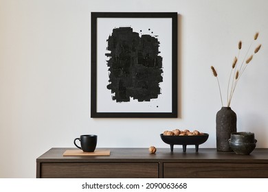 Minimalistic Composition Of Creative Living Room Interior With Mock Up Poster Frame And Stylish Small Personal Accessories On Wooden Commode. Copy Space. Template. Real Photo.
