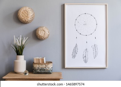Minimalistic composition of living room interior design with mock up poster frame, flowers in vase, rattan baskets and elegant accessories. Stylish home decor. Template. Gray background walls. 