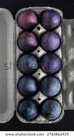minimalistic easter eggs in blue tones. cosmic blue and purple dark painted eggs, space, stone, concrete effect. hibiscus, dye, rice, mother of pearl