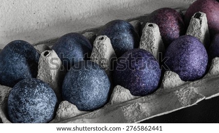 minimalistic easter eggs in blue tones. cosmic blue and purple dark painted eggs, space, stone, concrete effect. hibiscus, dye, rice, mother of pearl