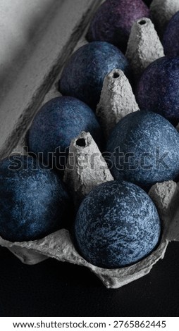 minimalistic easter eggs in blue tones. cosmic blue and purple dark painted eggs, space, stone, concrete effect. hibiscus, dye, rice, mother of pearl