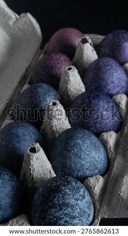 minimalistic easter eggs in blue tones. cosmic blue and purple dark painted eggs, space, stone, concrete effect. hibiscus, dye, rice, mother of pearl
