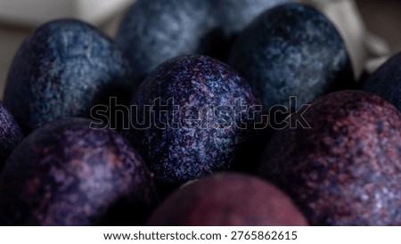minimalistic easter eggs in blue tones. cosmic blue and purple dark painted eggs, space, stone, concrete effect. hibiscus, dye, rice, mother of pearl