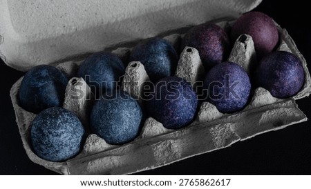minimalistic easter eggs in blue tones. cosmic blue and purple dark painted eggs, space, stone, concrete effect. hibiscus, dye, rice, mother of pearl