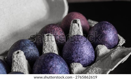 minimalistic easter eggs in blue tones. cosmic blue and purple dark painted eggs, space, stone, concrete effect. hibiscus, dye, rice, mother of pearl