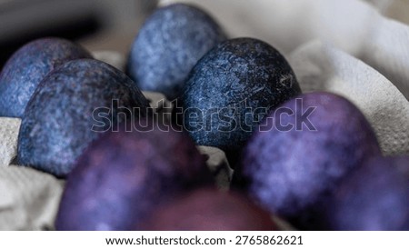 minimalistic easter eggs in blue tones. cosmic blue and purple dark painted eggs, space, stone, concrete effect. hibiscus, dye, rice, mother of pearl