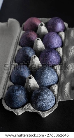 minimalistic easter eggs in blue tones. cosmic blue and purple dark painted eggs, space, stone, concrete effect. hibiscus, dye, rice, mother of pearl