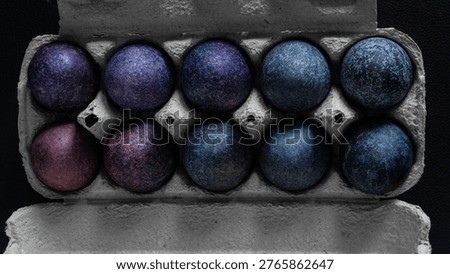 minimalistic easter eggs in blue tones. cosmic blue and purple dark painted eggs, space, stone, concrete effect. hibiscus, dye, rice, mother of pearl