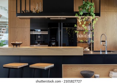 Minimalistic modern wooden panel kitchen interior with ergonomic biuld-in kitchen and kitchen island. Geometric forms and shapes. Details. Template.  - Shutterstock ID 2101827727