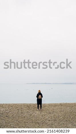 Similar – Senior sportswoman looking at the sea