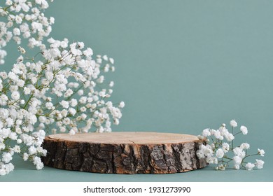 A minimalistic scene of a felled tree lies with flowers on a natural background. Catwalk for the presentation of products and cosmetics. Showcase with a stage for natural products. Empty space - Shutterstock ID 1931273990
