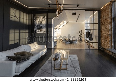 minimalistic stylish interior of luxury apartment with white stylish bedroom and dark living room. modern apartments with an open layout during the day without people and amazing sun rays
