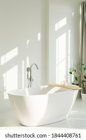 Minimalistic White Bathroom In White Room With Sun Rays