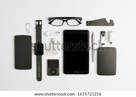 Minimum office set, electronic agenda (PDA) and accessories, white background, top view