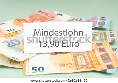 Minimum wage increase, Mindestlohn in german language, high living costs, workers and employees need higher income, inflation, expensive food and housing, social issue 